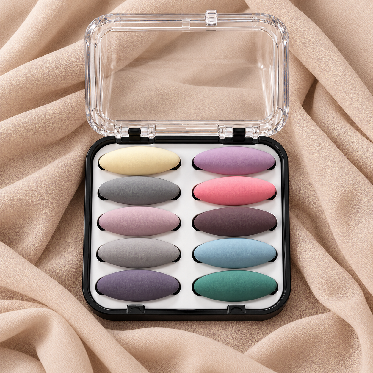 Ten matte hijab pins in their case on beige hijab fabric